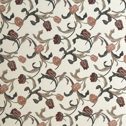 a sheet of italian wrapping paper with a multicoloured large floral pattern on cream paper 