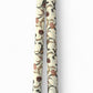 a sheet of italian wrapping paper with a multicoloured large floral pattern on cream paper. Pictured rolled 