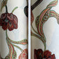 a sheet of italian wrapping paper with a multicoloured large floral pattern on cream paper 