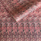 a sheet of Italian printed marbled paper with a marble design in pink, maroon and white