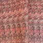 a sheet of Italian printed marbled paper with a marble design in pink, maroon and white