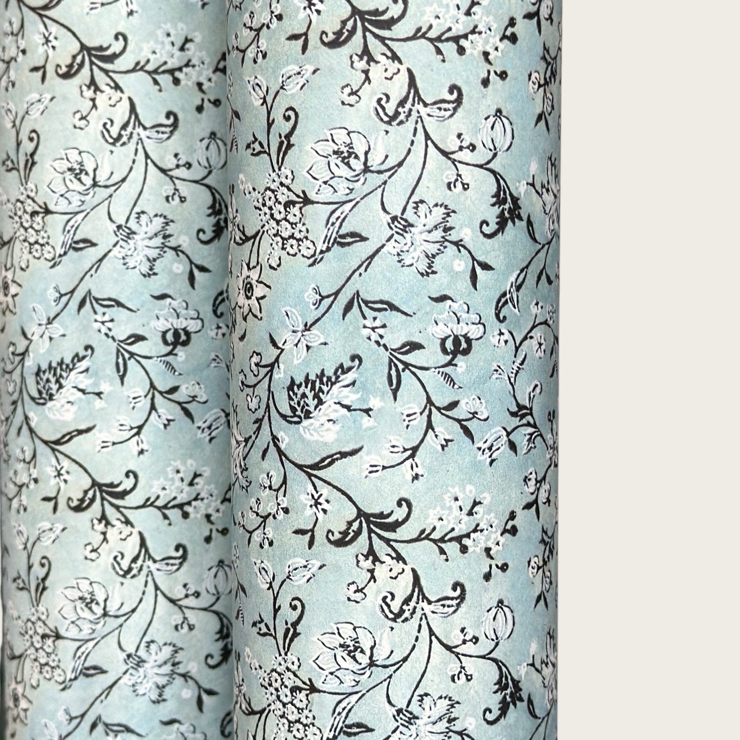 floral italian florentine wrapping paper with a white repeat floral on a mustard background