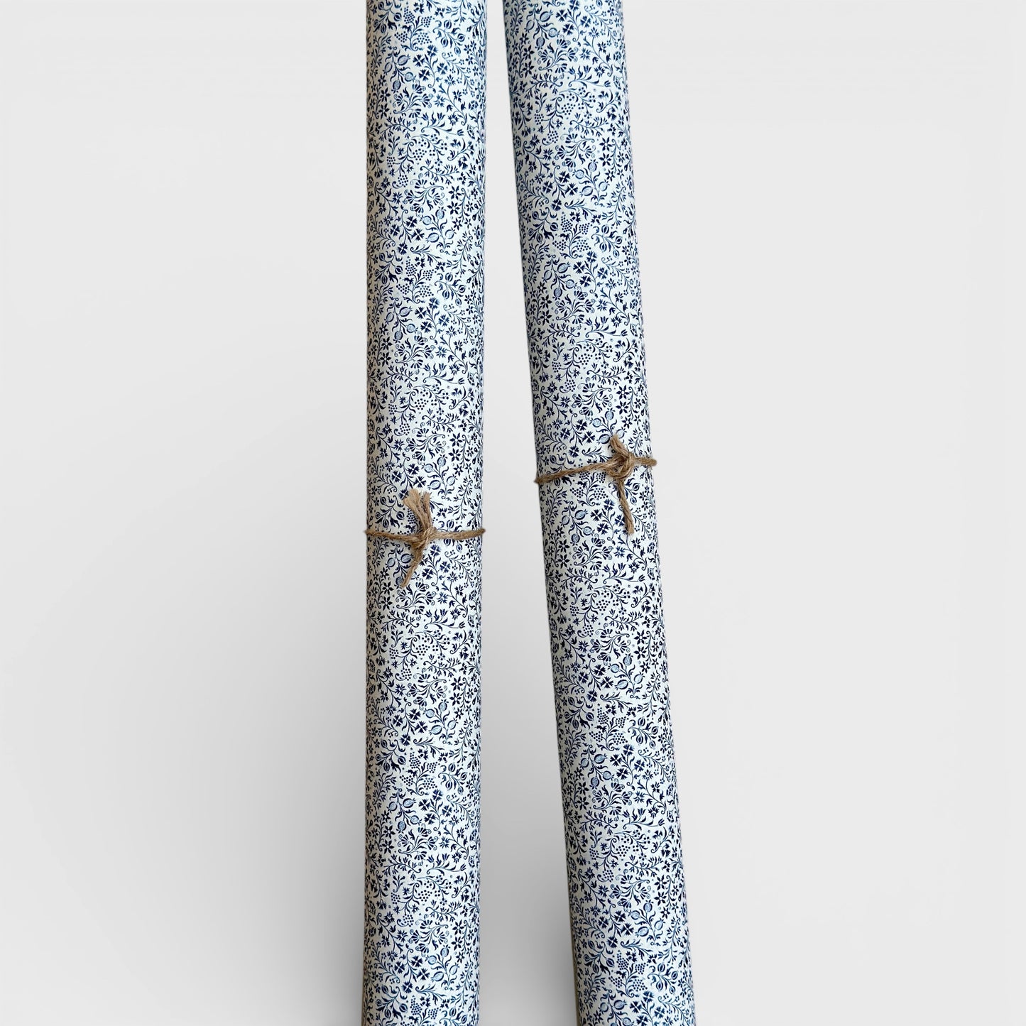 floral florentine italian wrapping paper with a micro floral repeat pattern on white background. Pictured rolled