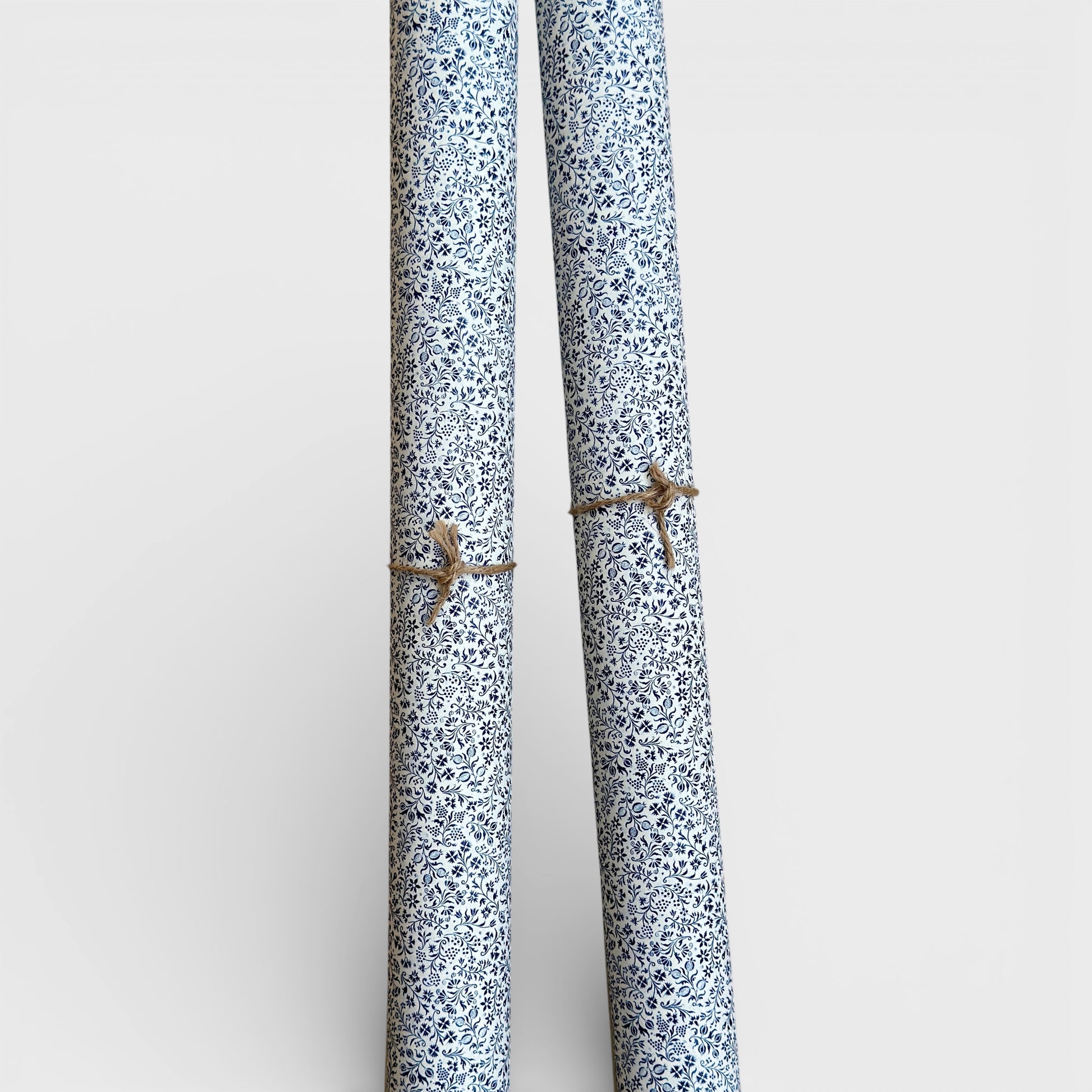 floral florentine italian wrapping paper with a micro floral repeat pattern on white background. Pictured rolled