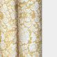 floral italian florentine wrapping paper with a white repeat floral on a mustard background