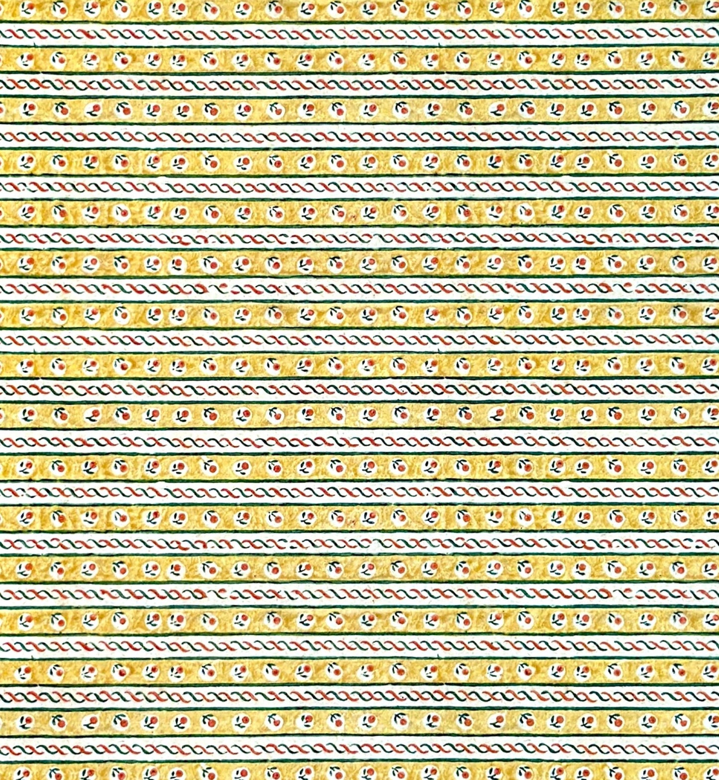 a sheet of florentine italian wrapping paper with a striped design in yellow, green, red and white with a little flower block print between the stripes