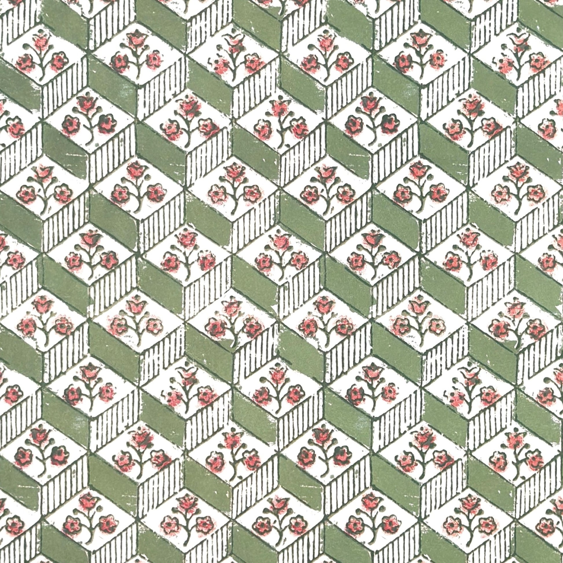 italian florentine wrapping paper with a geometric rombi design in green on white with a little block printed flower