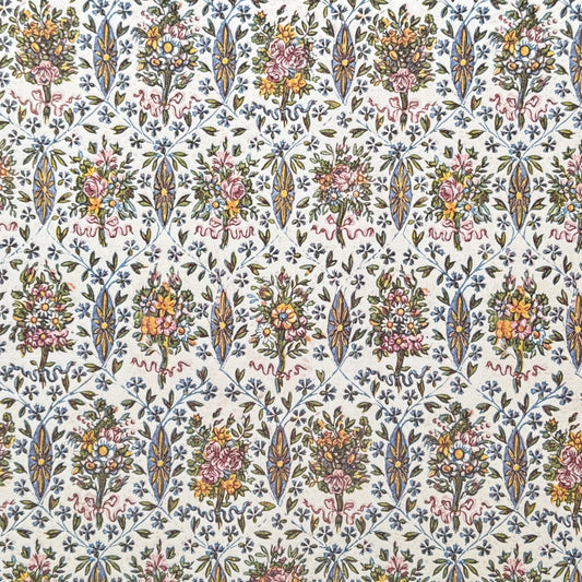 a sheet of italian wrapping paper with a mutlicoloured floral pattern on white