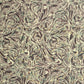 a printed marbled wrapping paper sheet with swirling brown, beige, muted green, and small yellow accents. By The Kensington Paperie brand