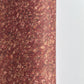 a marbled patterned wrapping paper with swirling abstract swirls in reddish brown, rust, beige, and muted gold tones.