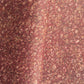 a marbled patterned wrapping paper with swirling abstract swirls in reddish brown, rust, beige, and muted gold tones.