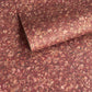 a marbled patterned wrapping paper with swirling abstract swirls in reddish brown, rust, beige, and muted gold tones.