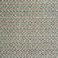 A sheet patterned wrapping paper with a repeating floral medallion design in muted green, dusty pink, and cream by The Kensington Paperie brand
