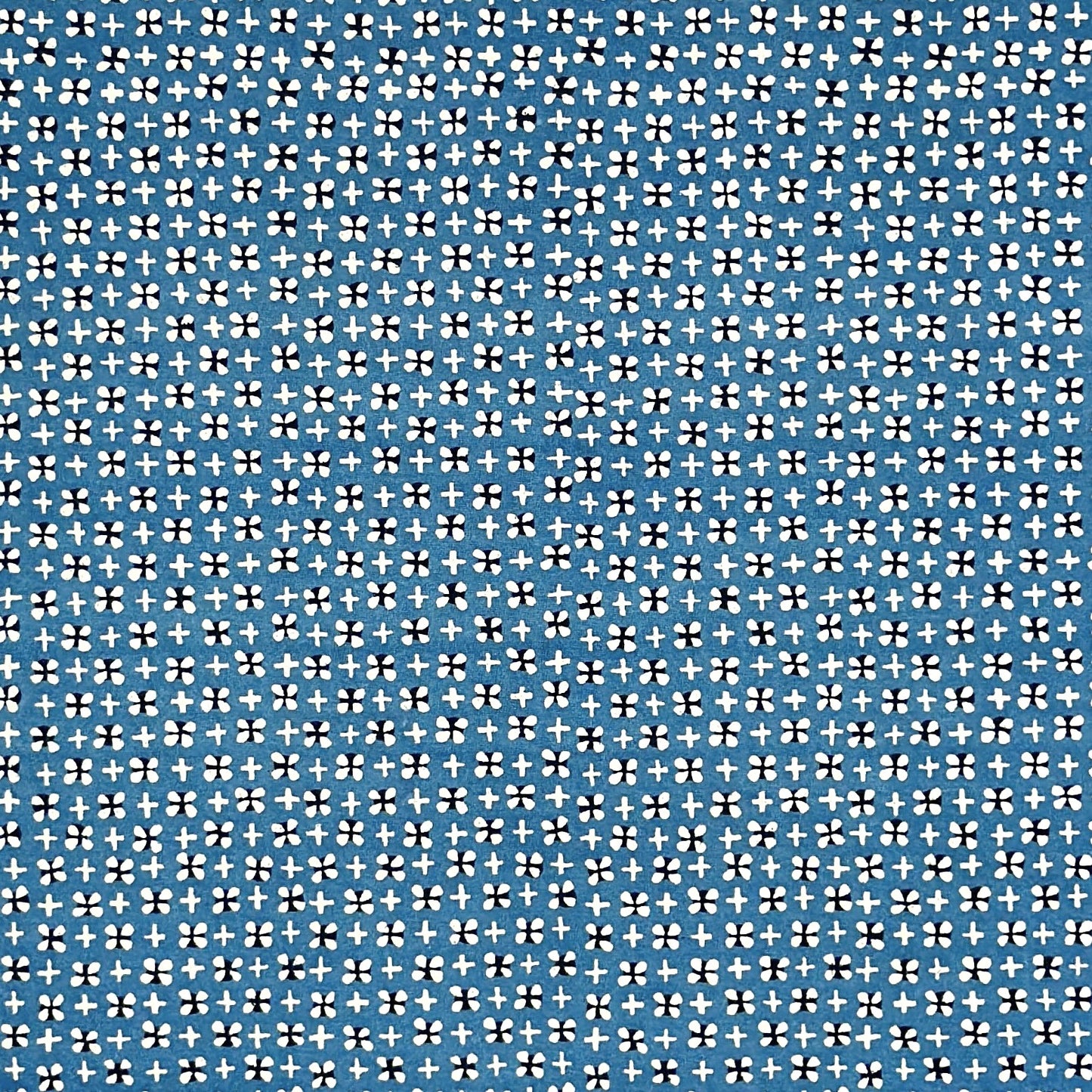 vintage katazome-shi stencil-dyed small papers from Japan. Cerulean blue paper with tiny motifs in cream and black. 