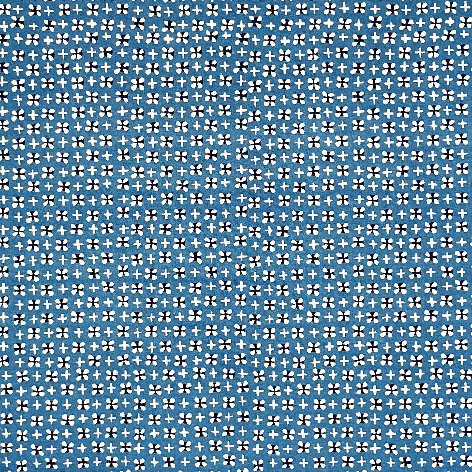 vintage katazome-shi stencil-dyed small papers from Japan. Cerulean blue paper with tiny motifs in cream and black. 