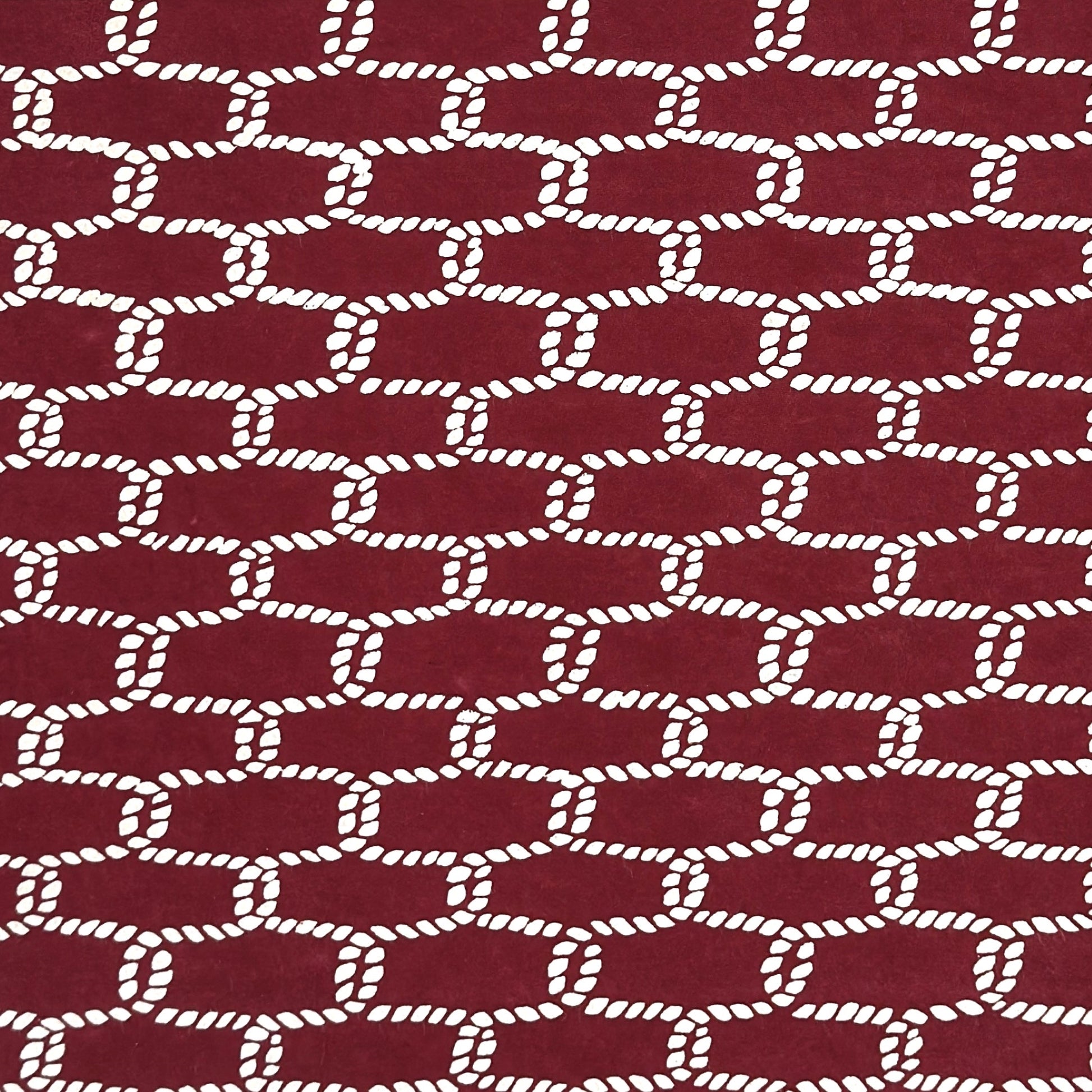 vintage katazome-shi stencil-dyed small papers from Japan. burgundy paper with a cream link pattern. 