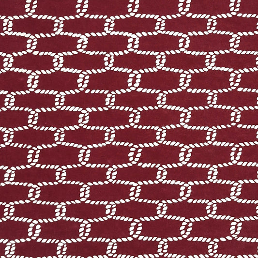 vintage katazome-shi stencil-dyed small papers from Japan. burgundy paper with a cream link pattern. 
