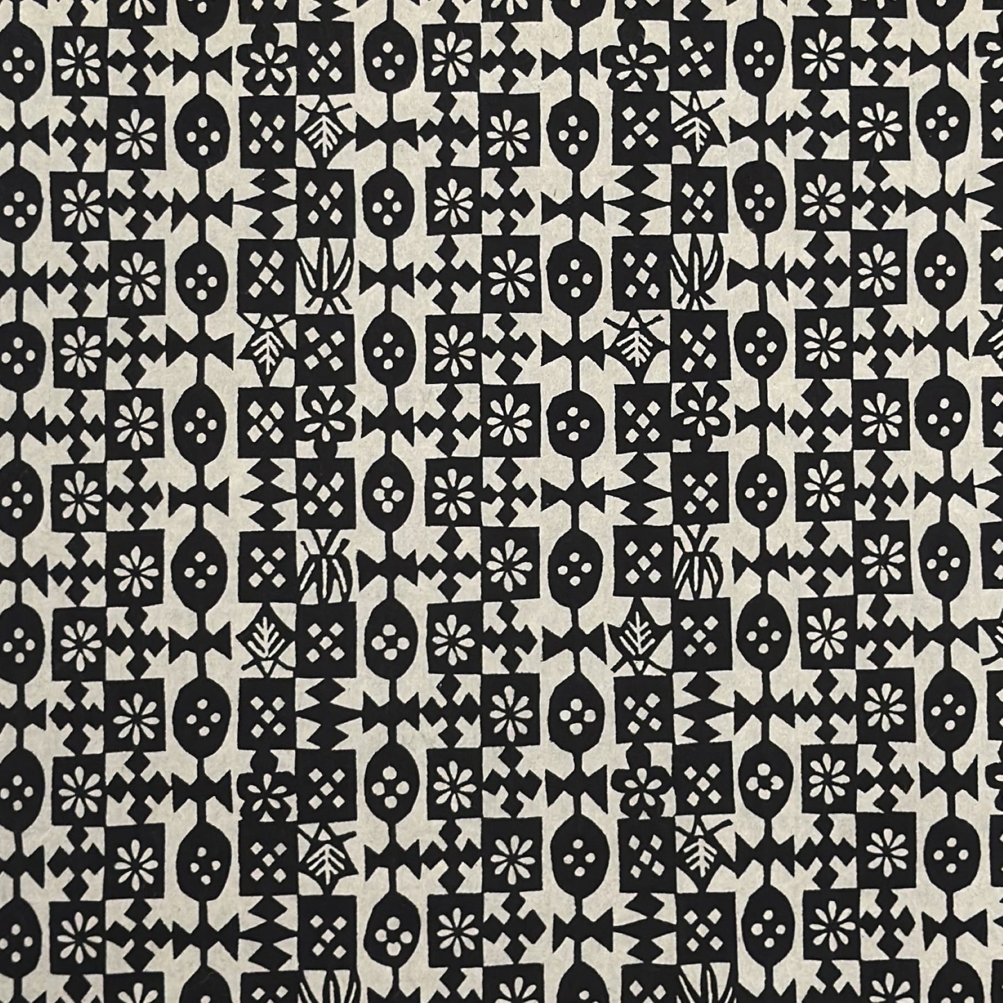 vintage katazome-shi stencil-dyed small papers from Japan. Cream paper with black geometric design. 
