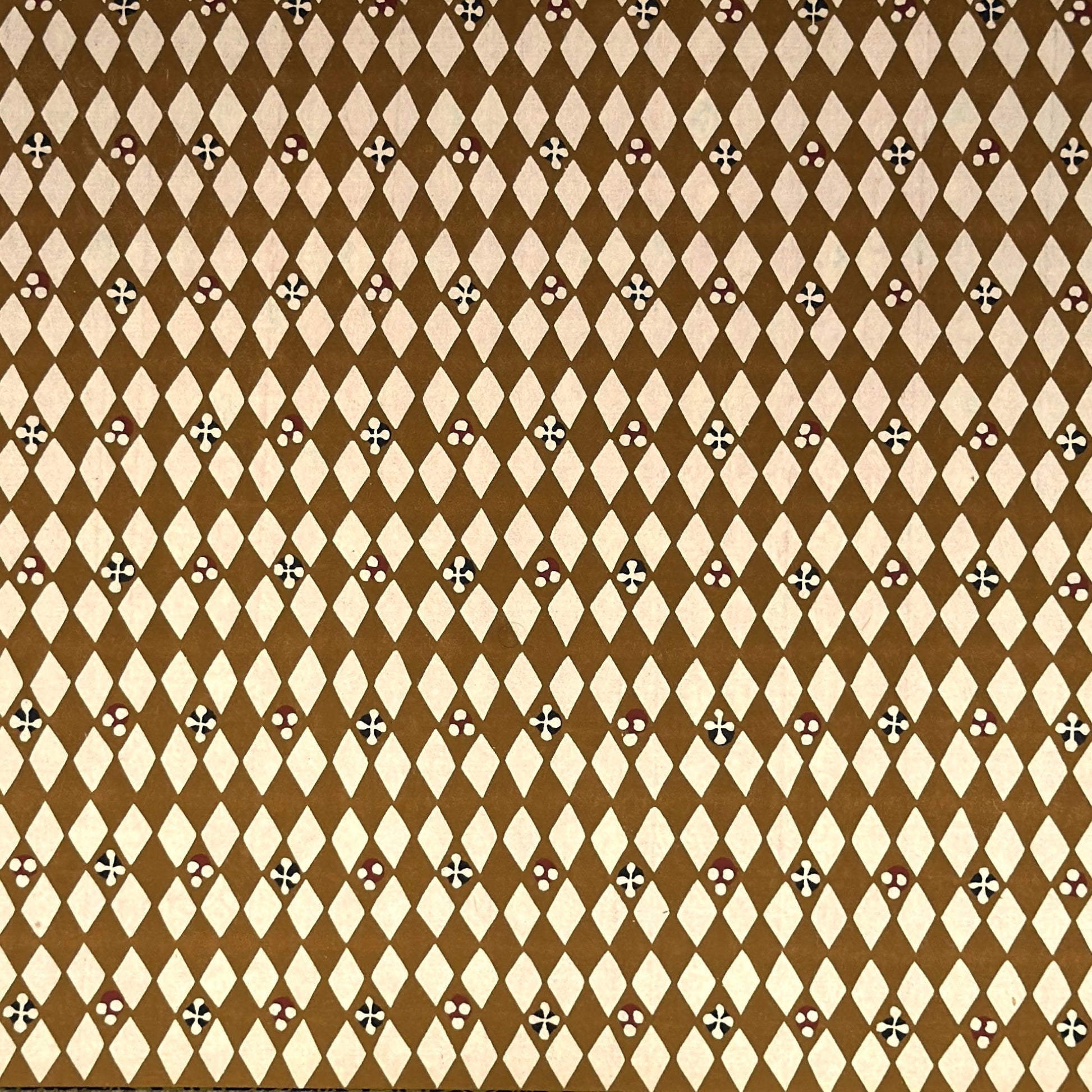 vintage katazome-shi stencil-dyed small papers from Japan. Cream paper with brown diamond pattern. 