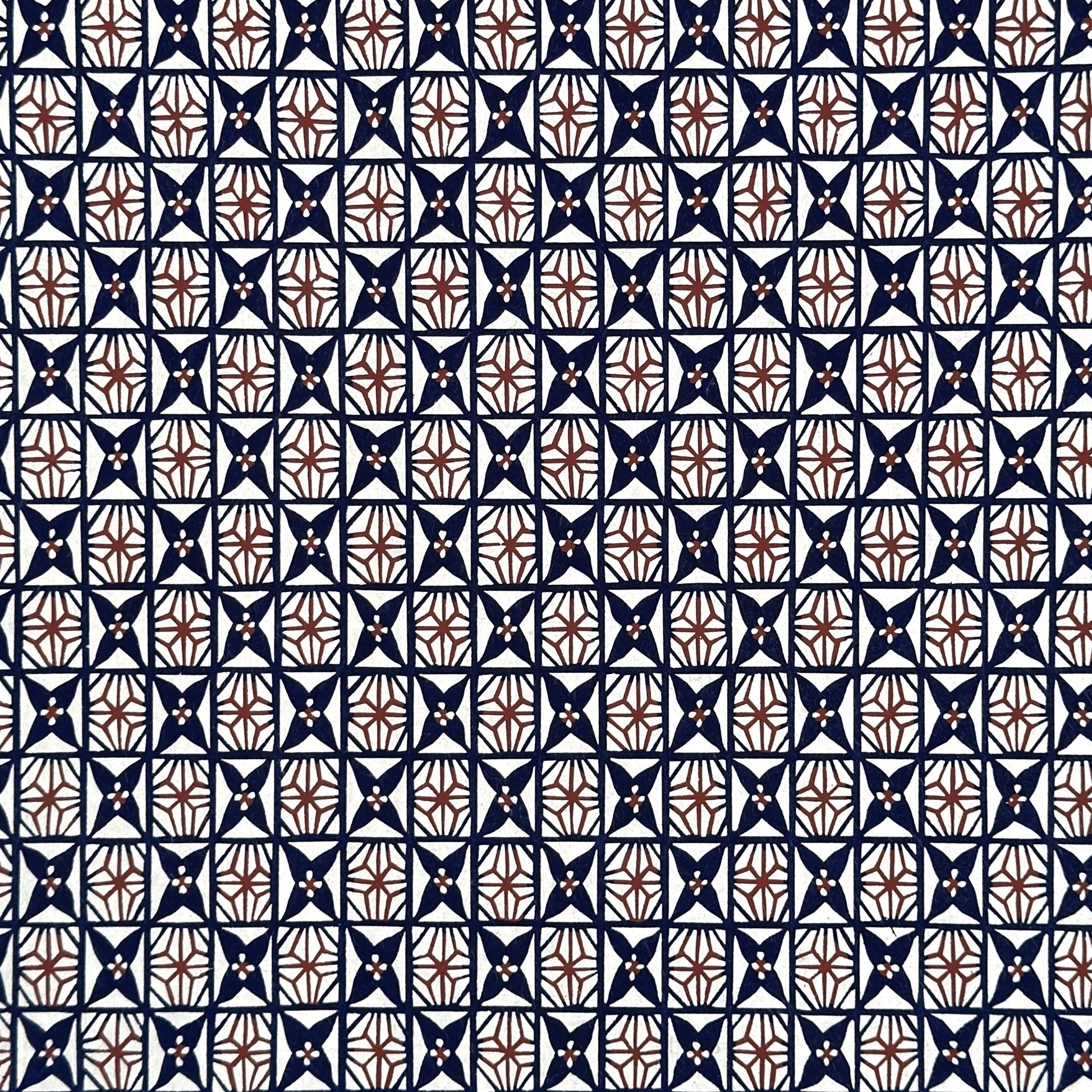 vintage katazome stencil dyed paper. Navy and red star pattern on cream paper. 