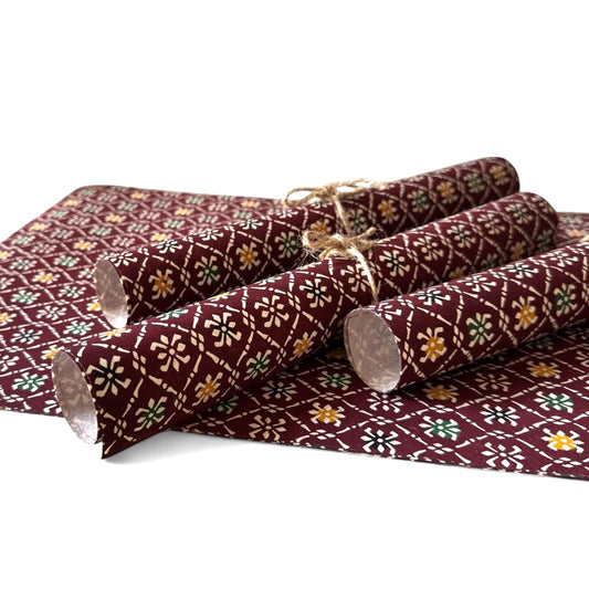 vintage katazome stencil dyed paper. Brown paper with white check motifs. Pictured rolled