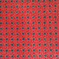 vintage katazome stencil dyed paper. red geometric design with dark blue circles and white lines.  