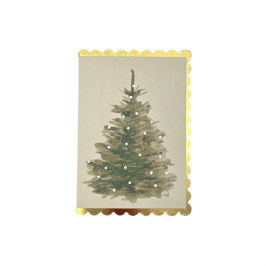 small card with a painting of a christmas tree with white lights on a cream background. The christmas card has a gold foiled scalloped edge. By Wanderlust