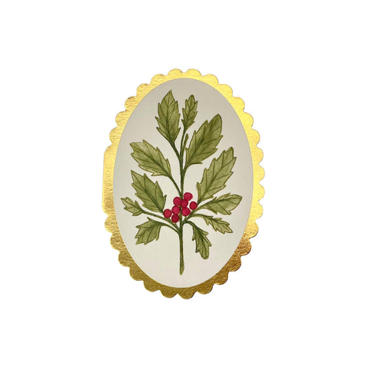 small oval card with a drawing of a sprig of holly on a cream background. the card has a gold foiled scalloped edge. By Wanderlust