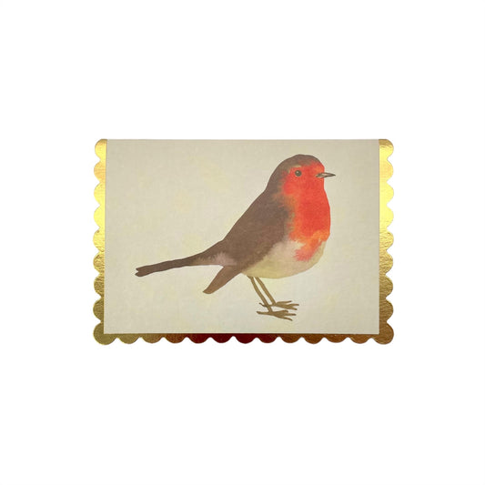 little christmas card of a robin on a cream background. the christmas card has a gold foiled scalloped edge. By Wanderlust