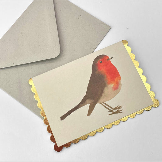 little christmas card of a robin on a cream background. the christmas card has a gold foiled scalloped edge. By Wanderlust. With envelope