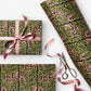 floral patterned wrapping paper in green and pink. pictured wrapped