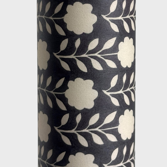 floral patterned wrapping paper in brown and cream. Close up