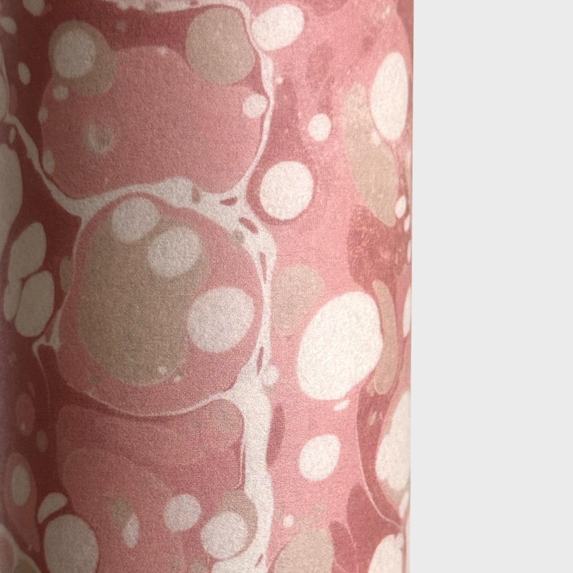 Printed marbled wrapping paper in dusty pink, taupe and white. 