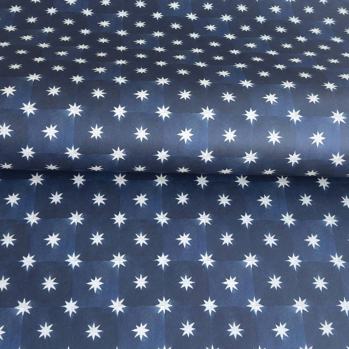 chequered navy blue with cream stars patterned wrapping paper 