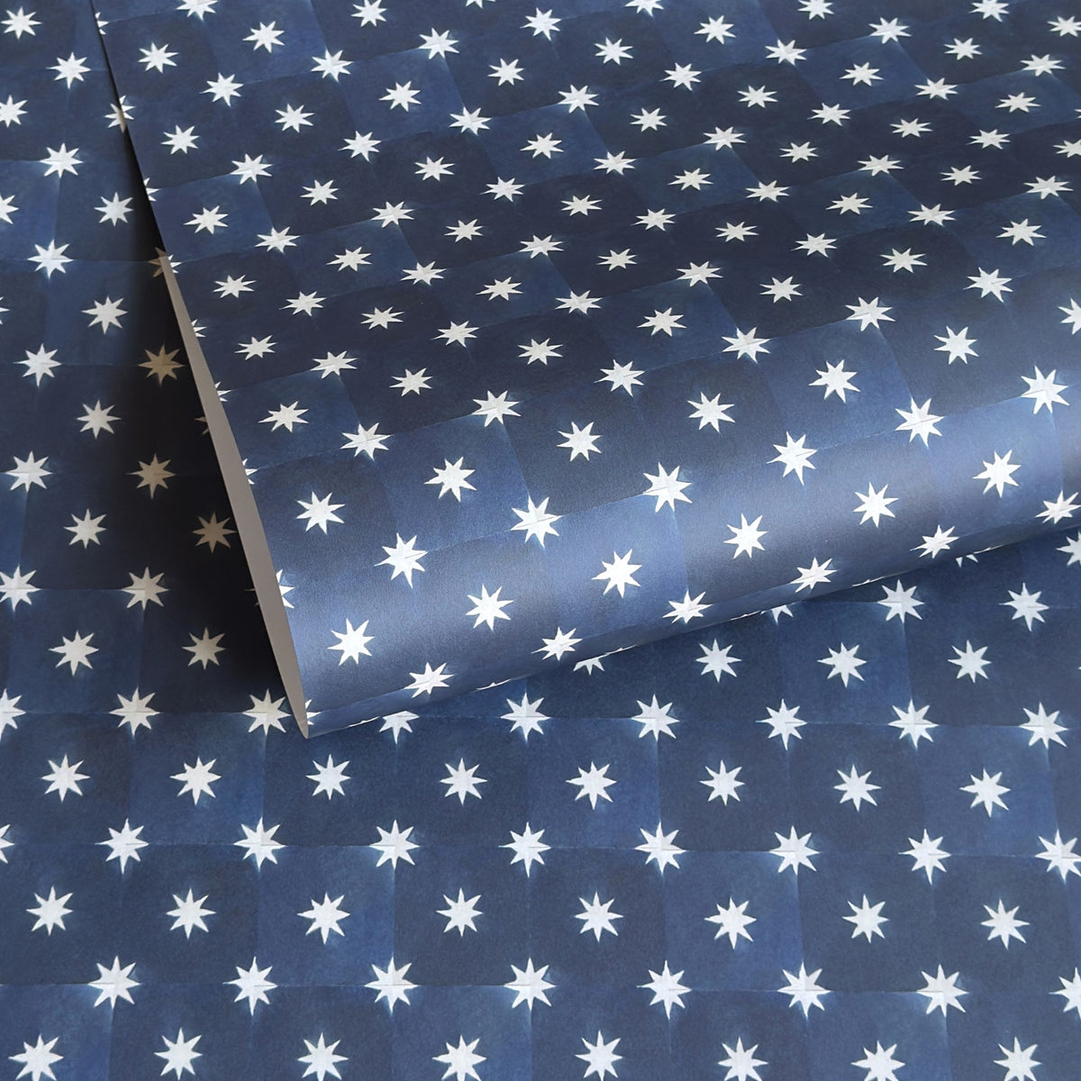 chequered navy blue with cream stars patterned wrapping paper 