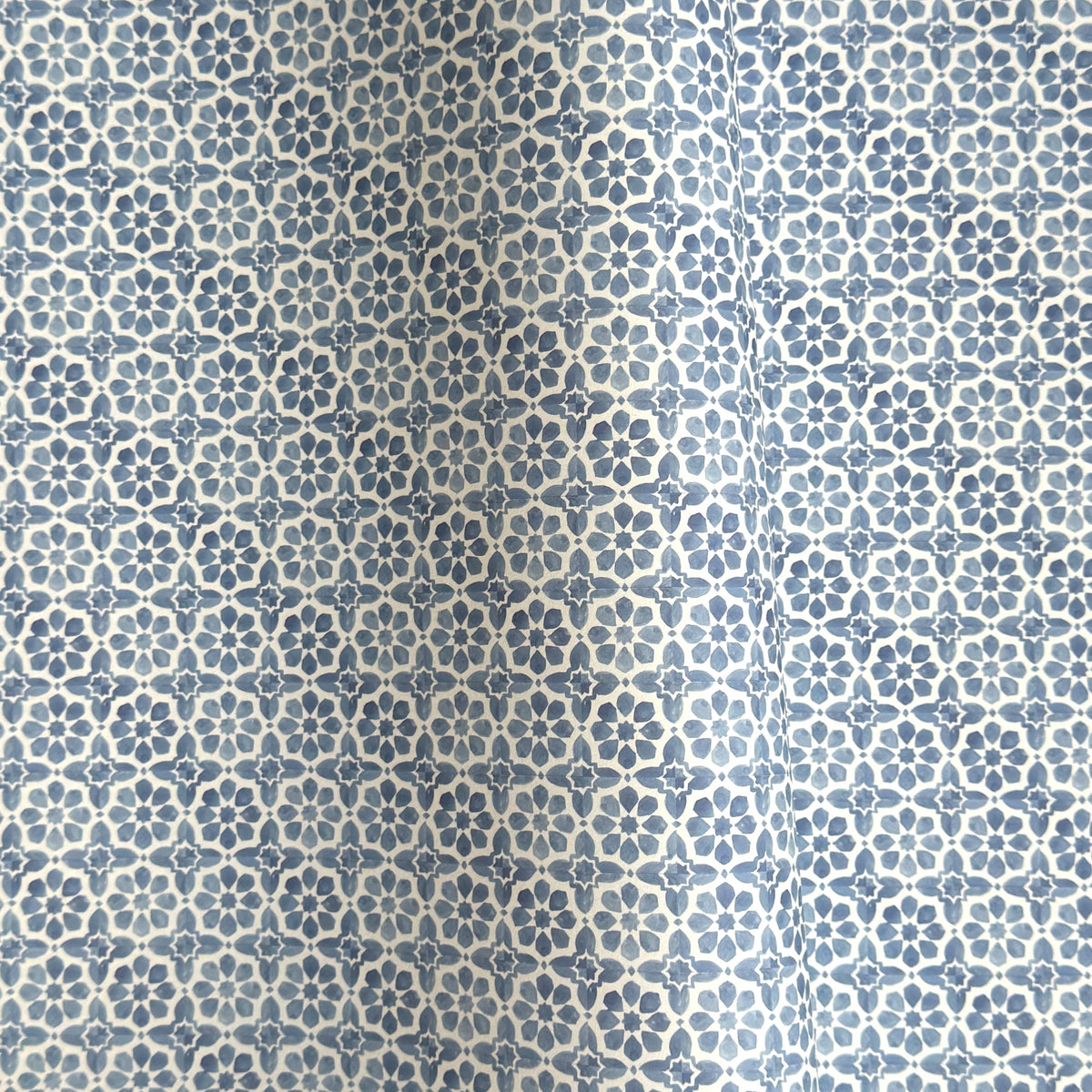 patterned paper / gift wrap with a blue and white tile design. By Wanderlust