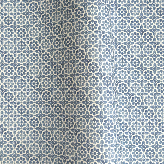 patterned paper / gift wrap with a blue and white tile design. By Wanderlust