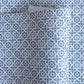 patterned paper / gift wrap with a blue and white tile design. By Wanderlust