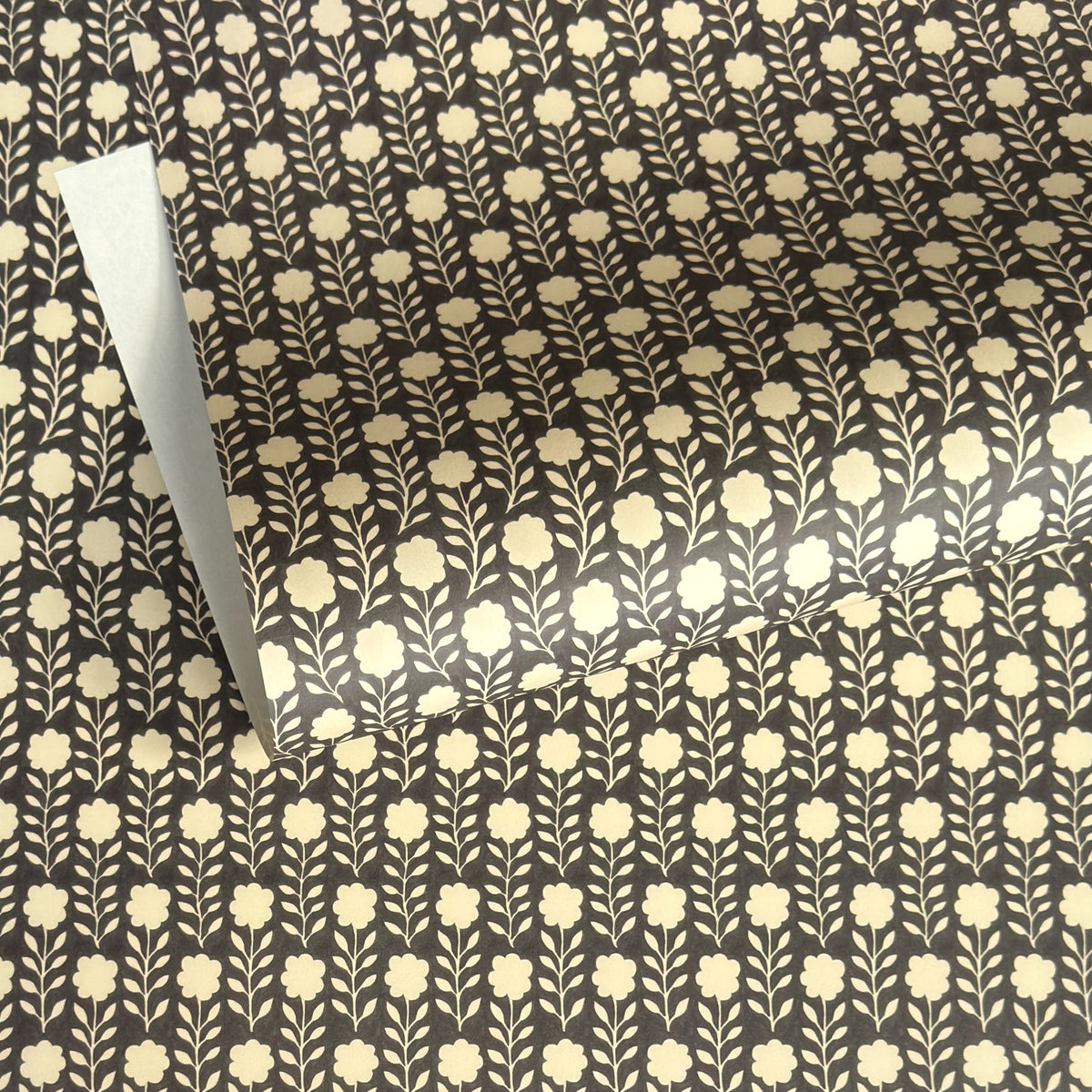 floral patterned wrapping paper in brown and cream
