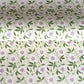 floral wrapping paper with pink passion flowers, green leaves on a cream background  