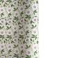 floral wrapping paper with pink passion flowers, green leaves on a cream background  