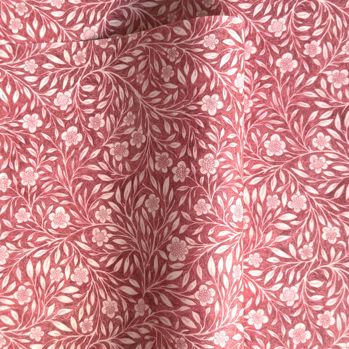 patterned paper / gift wrap with a delicate floral pattern in deep pink and white by Wanderlust