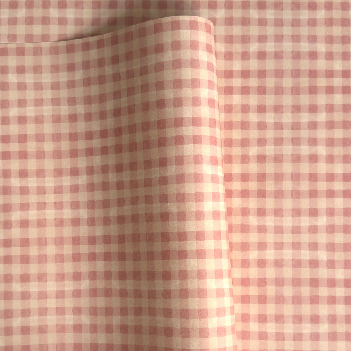 Checkered pattern wrapping paper with pink and beige squares