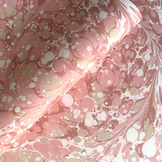 Printed marbled wrapping paper in dusty pink, taupe and white. 
