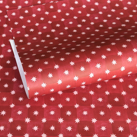 Red two-tone checked wrapping paper by Wanderlust with a white star pattern 