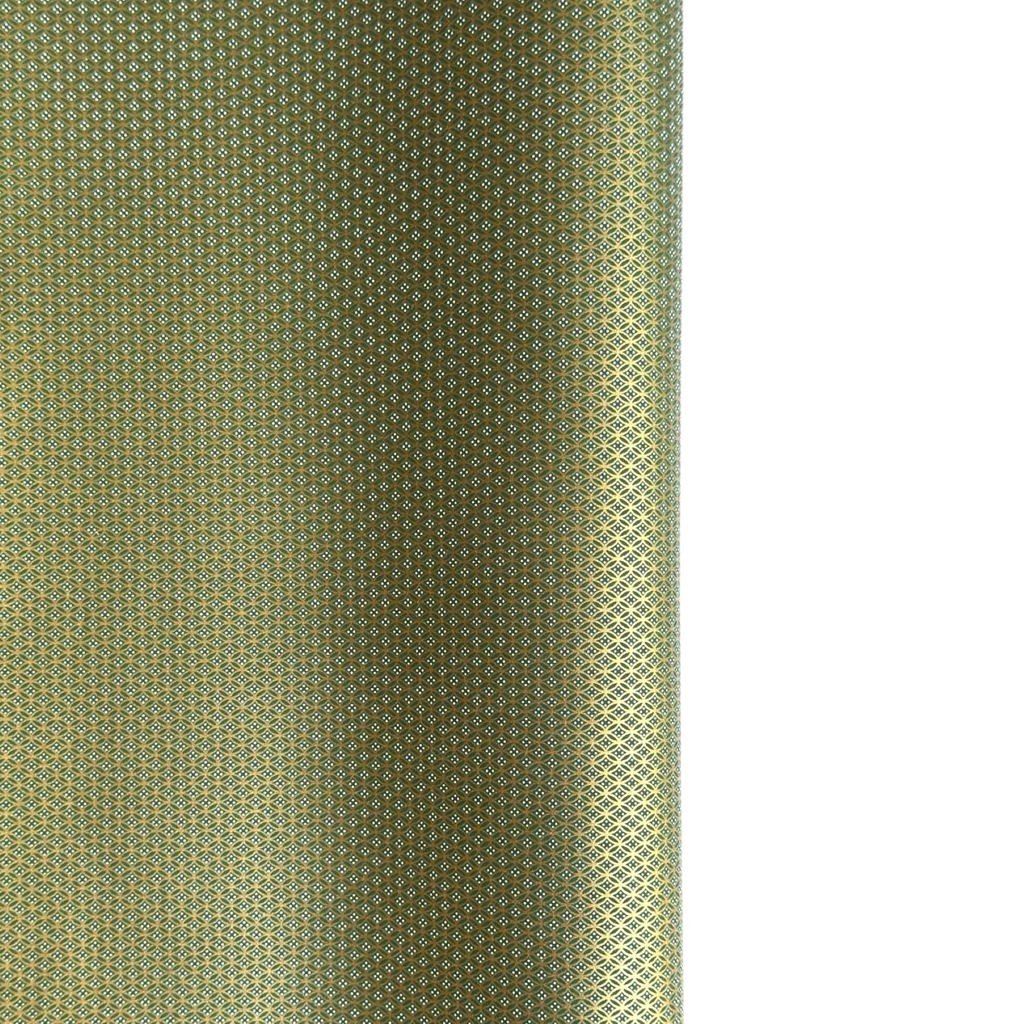 a sheet of Japanese silkscreen printed chiyogami paper with a mini geometric design in gold on green backdrop 