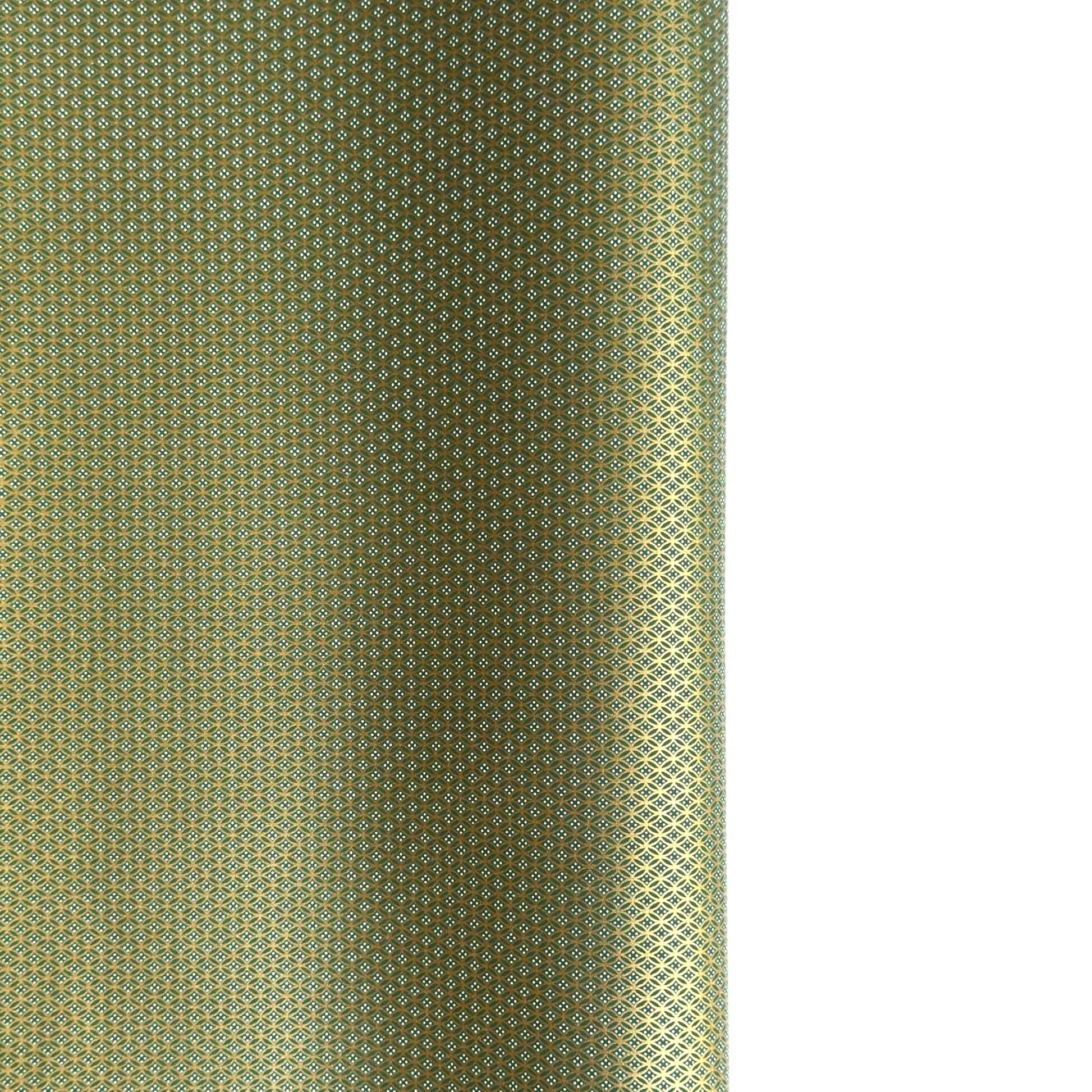 a sheet of Japanese silkscreen printed chiyogami paper with a mini geometric design in gold on green backdrop 