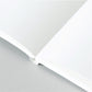 A5 softback notebook with plain white inner pages