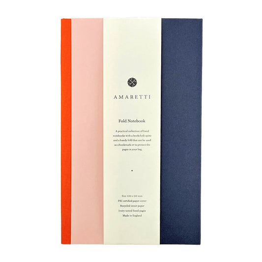 A lined notebook with striped block colours in orange, rose and navy by Amaretti Design
