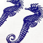 small greetings card of six blue seahorses, close up of the card